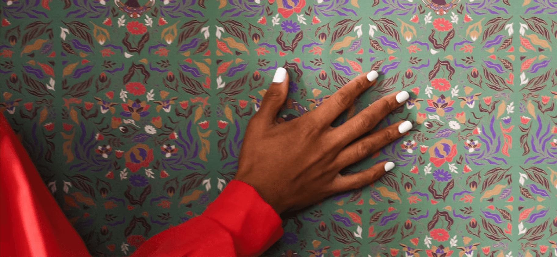 Hands placing wallpaper during material selection